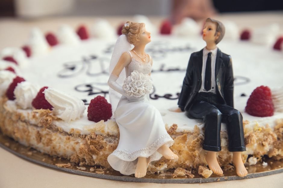 Topo com miniatura que representa o casal